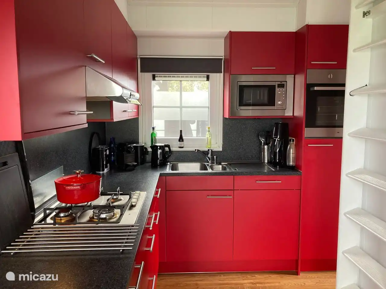View of refrigerator and dishwasher