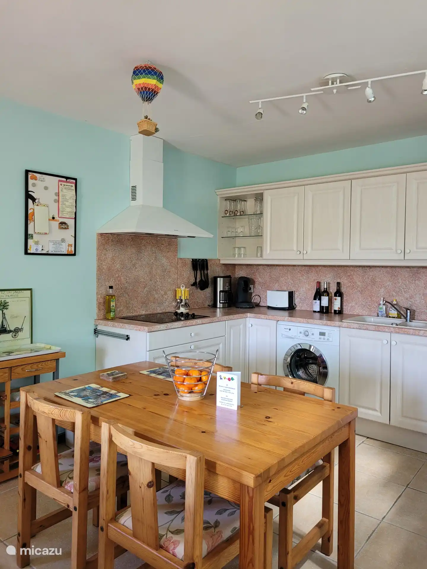 The extensive fully equipped kitchen, with electric hob, extractor hood, washing machine, dishwasher, oven, fridge-freezer, microwave, Senseo and coffee maker
