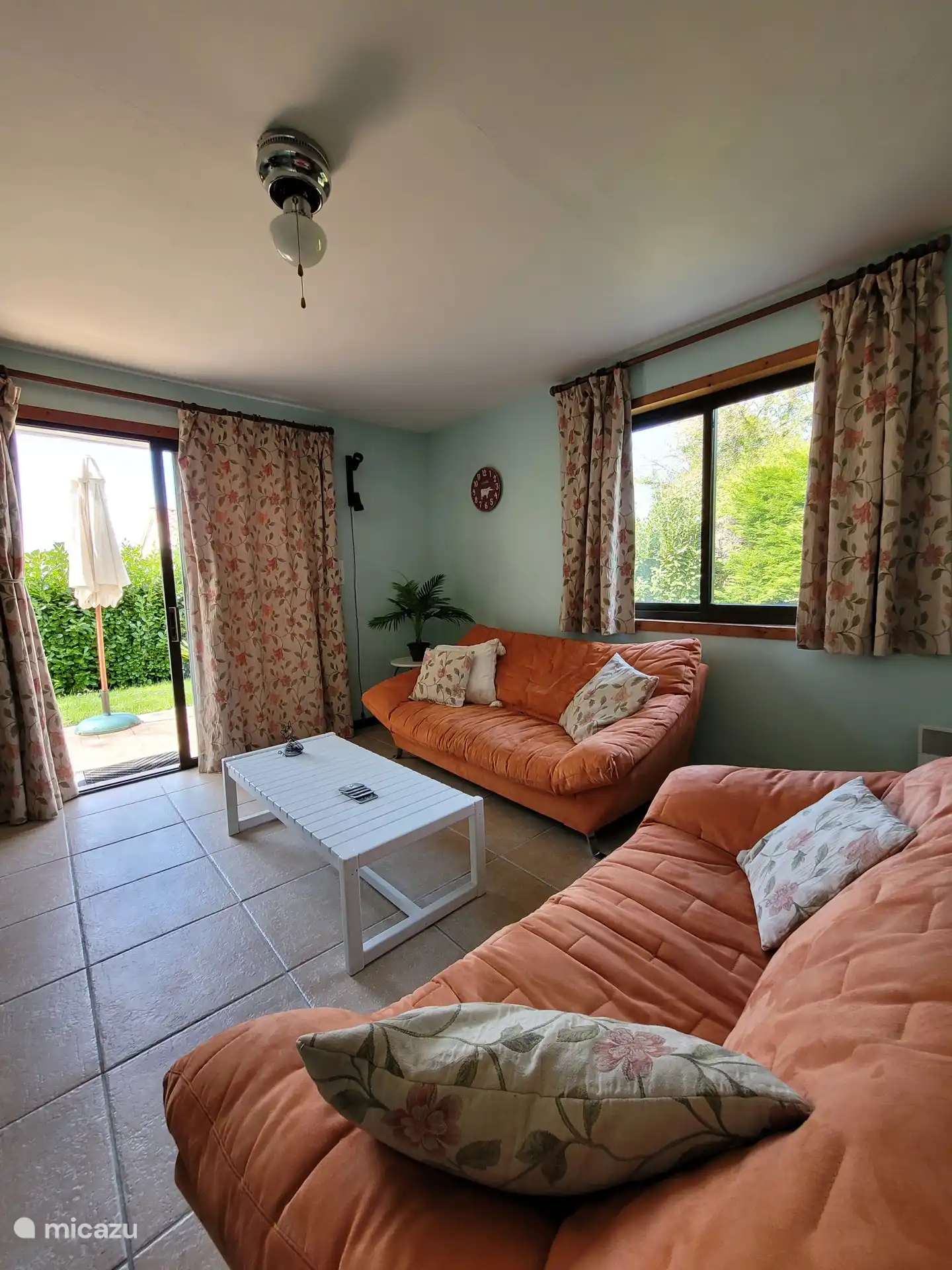 The living room with lovely seating area, Smart TV, XBOX, CD player, books and magazines
