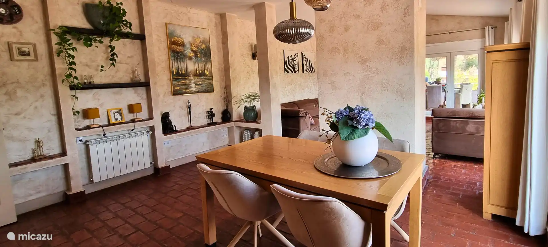 Living/dining room of the main house with direct access to the porch.
