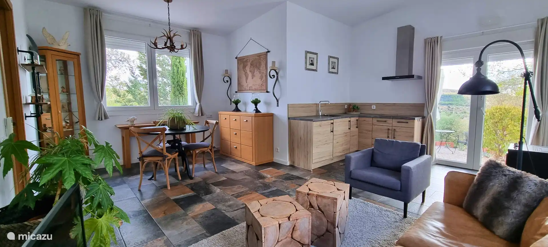 Living/dining room with kitchen of the apartment.