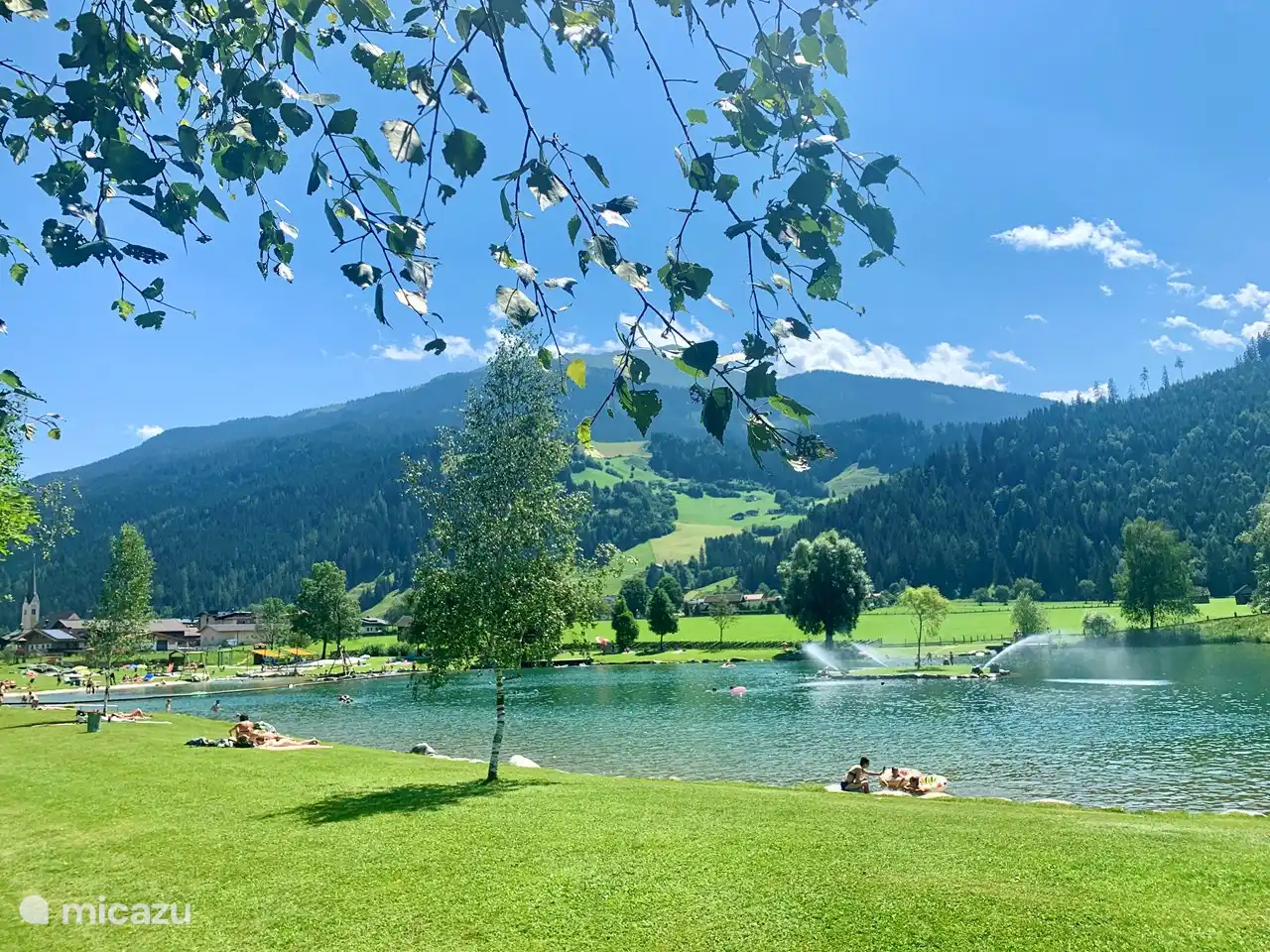 The natural swimming lake in Hollersbach, located right next to the valley station of the gondola. For the children there is plenty of fun, a beach with a pirate ship, a cable car over the water, slides.