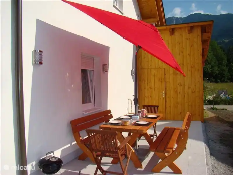 Side porch with picnic. A wonderful place for summer breakfast and evening meal.