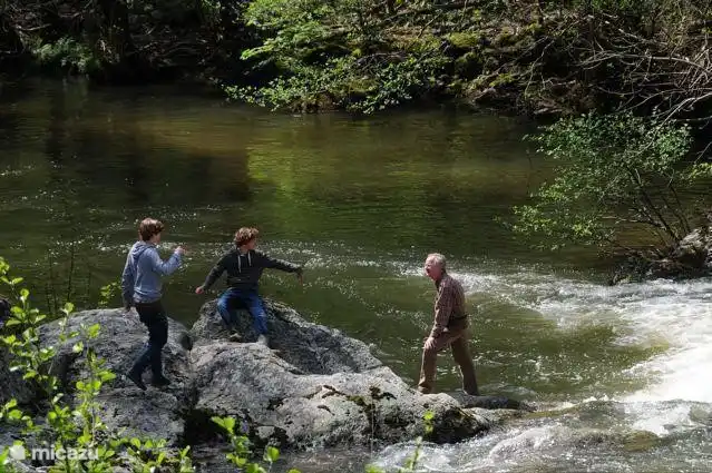 Playing at the waterfall in the Duzon