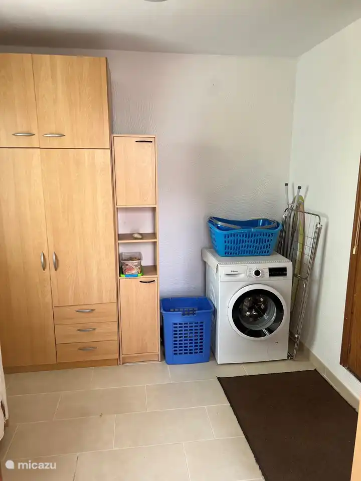 Hall with washing machine and linen/bedding cupboards