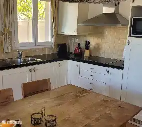 Very well equipped kitchen overlooking the terrace. Mosquito nets on all windows.