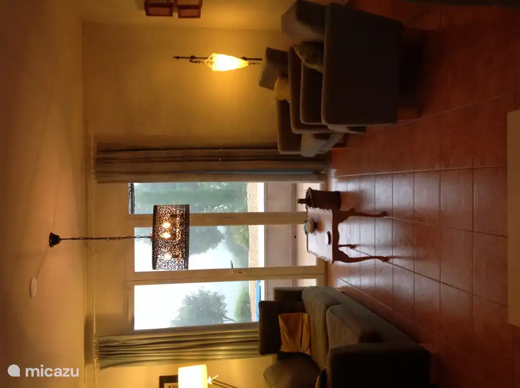 Interior view of the backyard. With door to terrace.