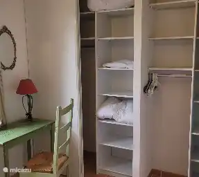 All rooms have a very spacious closet with hanging and storage space. mirror, brocante lamps and bedside tables, mosquito nets and air conditioning.