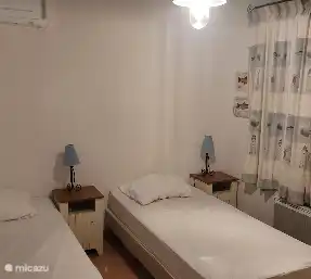 Bedroom 4 upstairs, view of the front garden and back domaine. Theme the ocean. Mosquito nets and air conditioning.