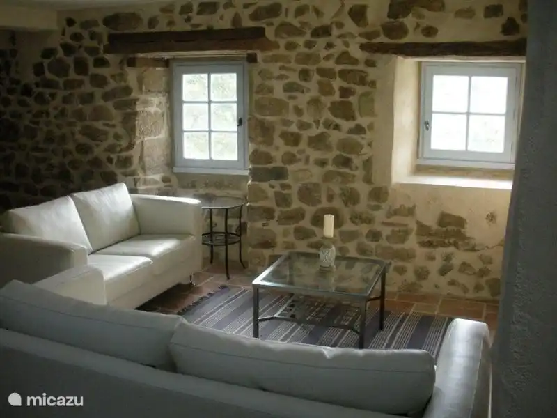 Living area with 2 white leather sofas