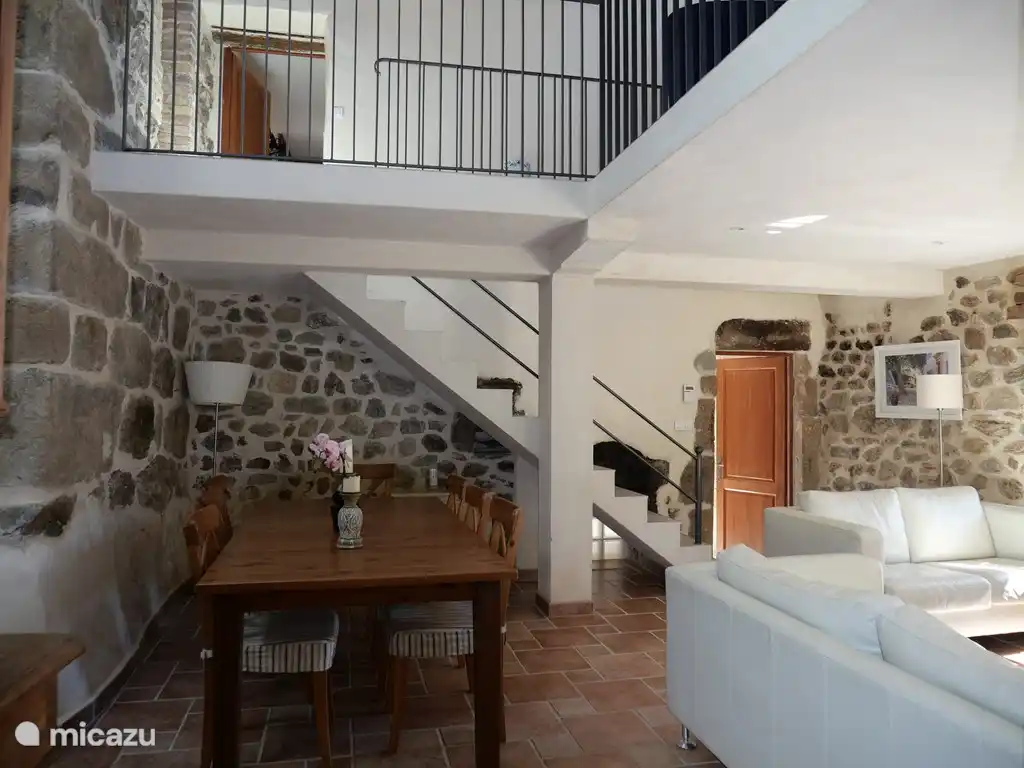 sitting room with stairs to 1st floor