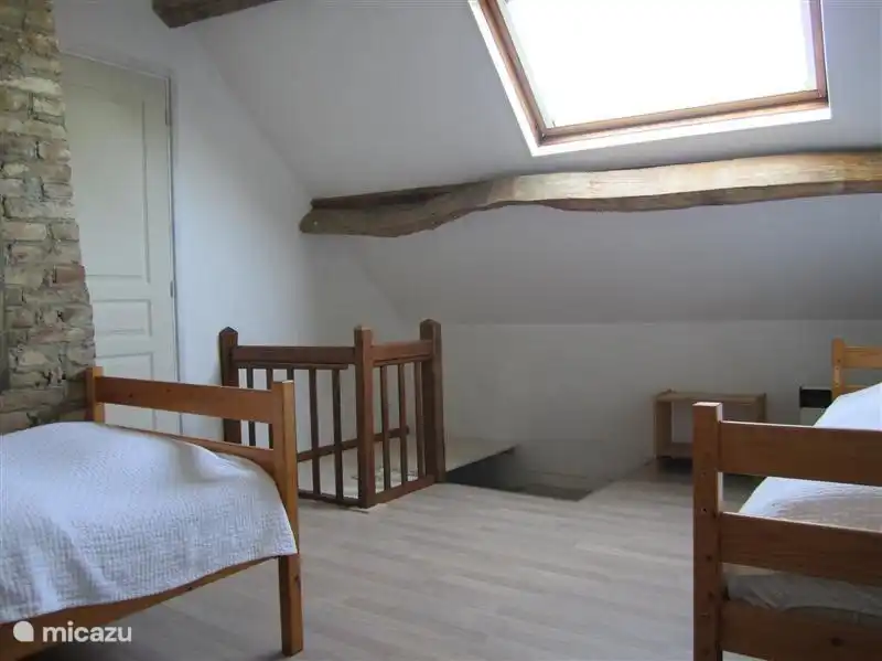 Bedroom 2 with two single beds. Access via stairs from ground floor and door through to bedroom 1. The staircase can be shut off for small children with a locked panel.