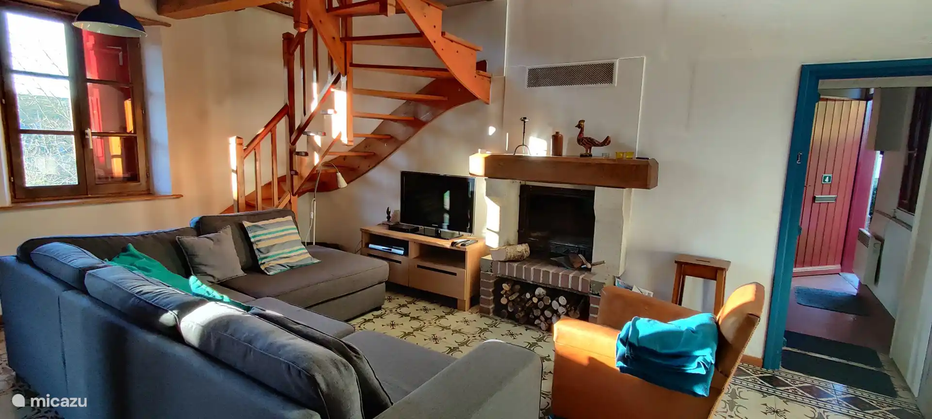 Lounge with access to kitchen and stairs to bedroom 1