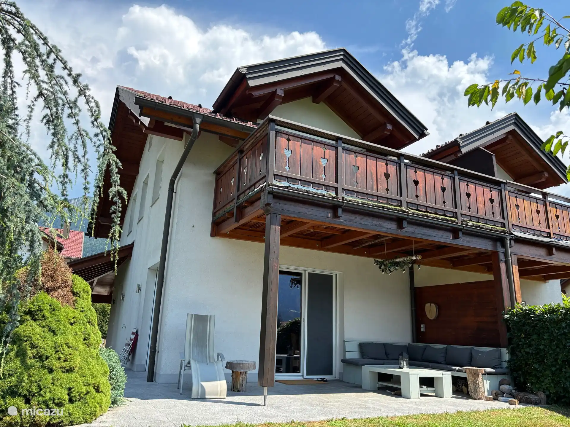 At the rear of the house are two terraces, on the south side it is covered.