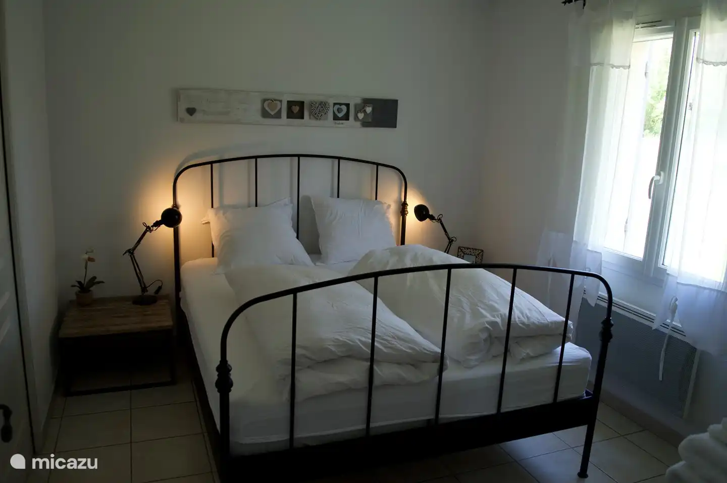 Bedroom 1 on the ground floor, with private bathroom with shower, hairdryer and sink. This bedroom has a ceiling fan, with remote control.