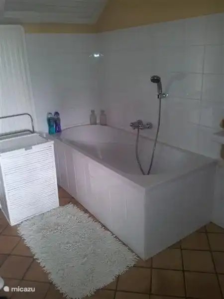 The bathroom with bath and separate shower, offers all the space and tranquility to start a new day.