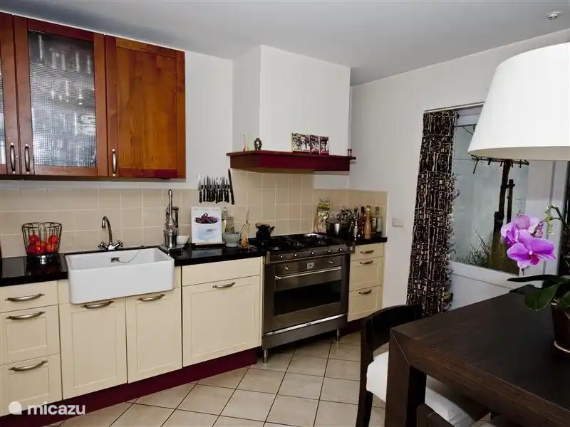 The kitchen is equipped with all facilities (almost) nothing. The kitchen has direct access to the garden.