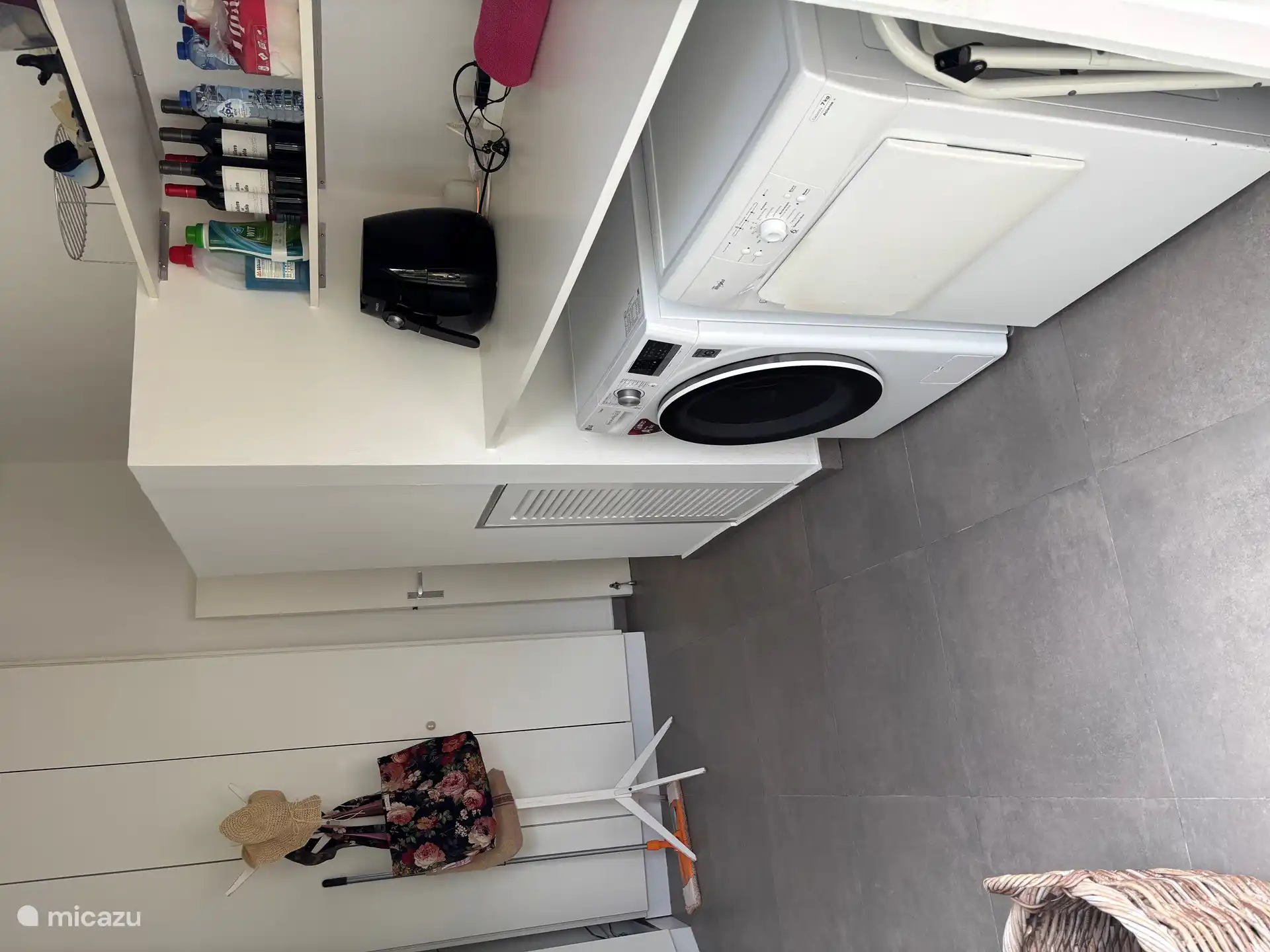Utility room with washing machine and dryer