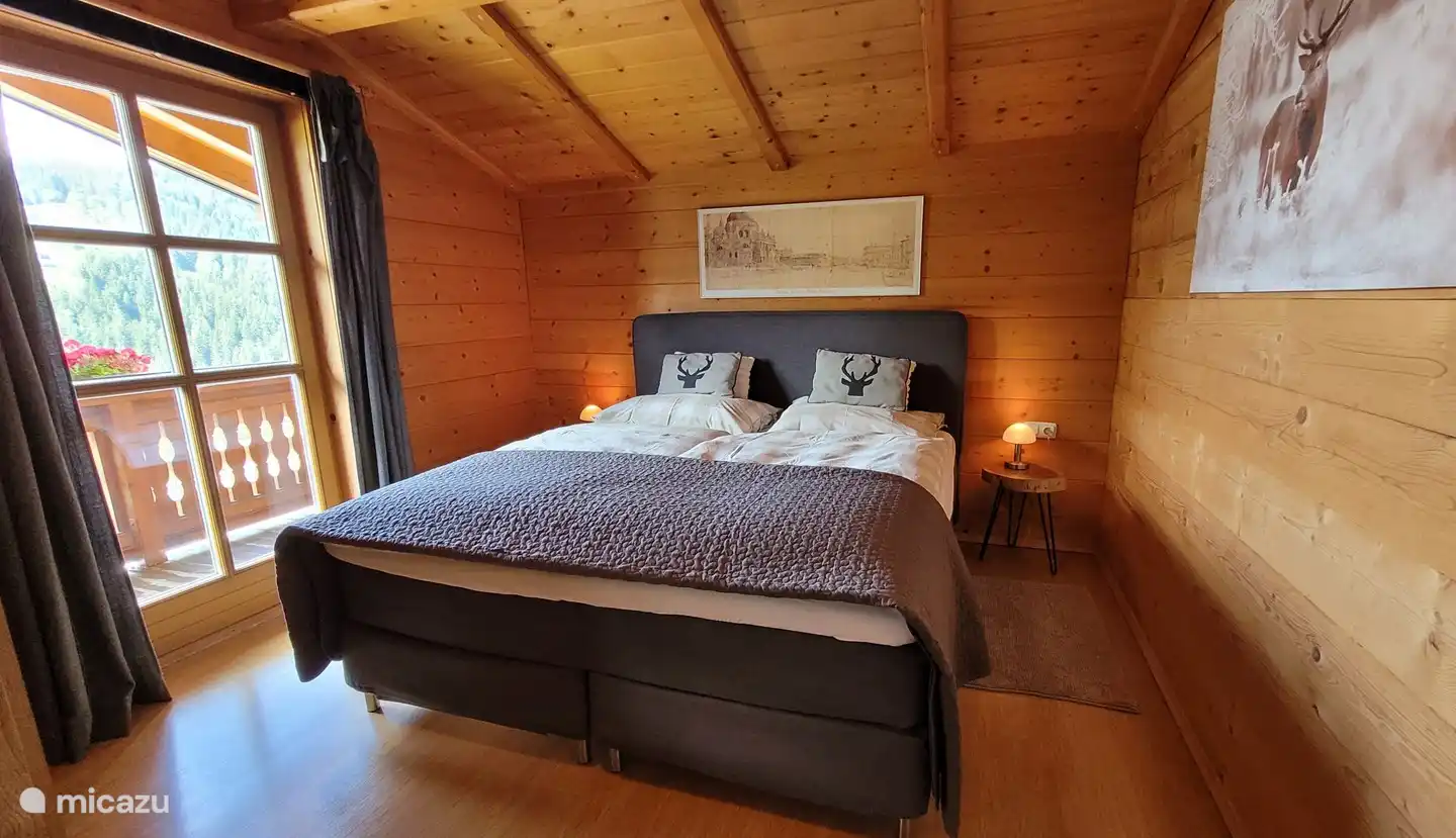 Bedroom with king-size box spring bed