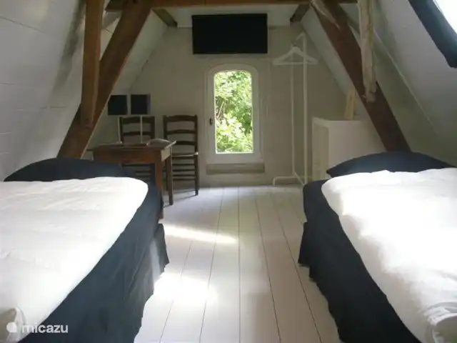 Ti & Gigré en Bélgica, Amberes, Malle - casa vacacional Dormitorio en el primer piso. Las dos camas individuales también se pueden juntar.