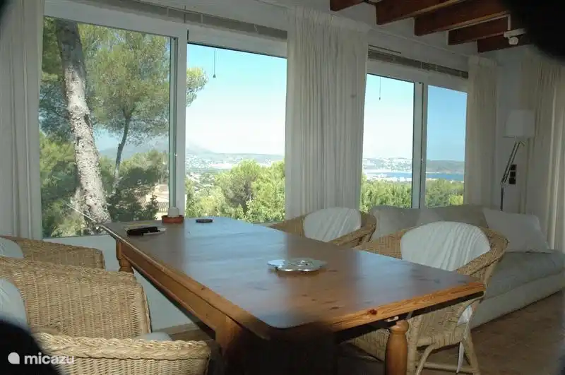 A second dining table in the conservatory for dinner with stunning views