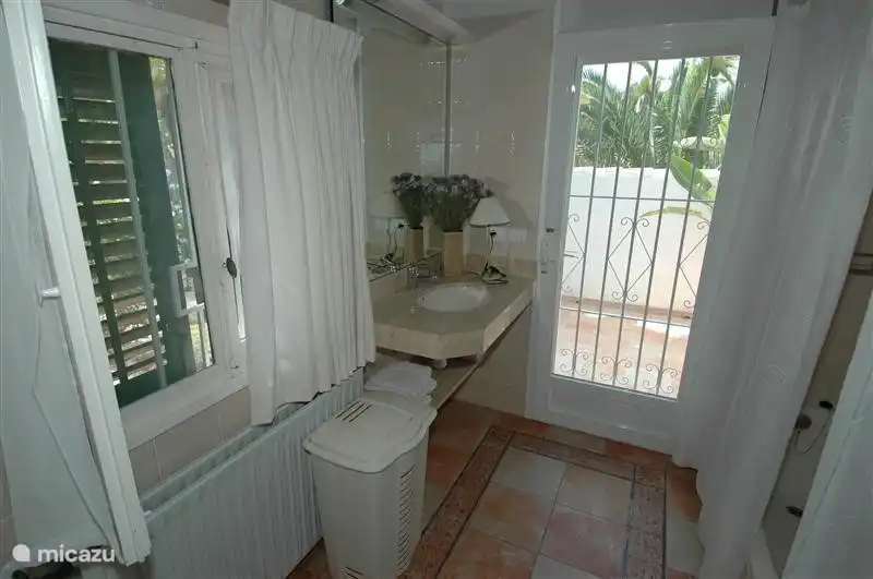 Bedroom with ceiling fan.