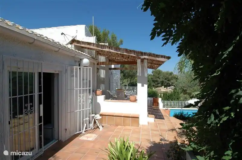 Side of the house with entrance to the kitchen
