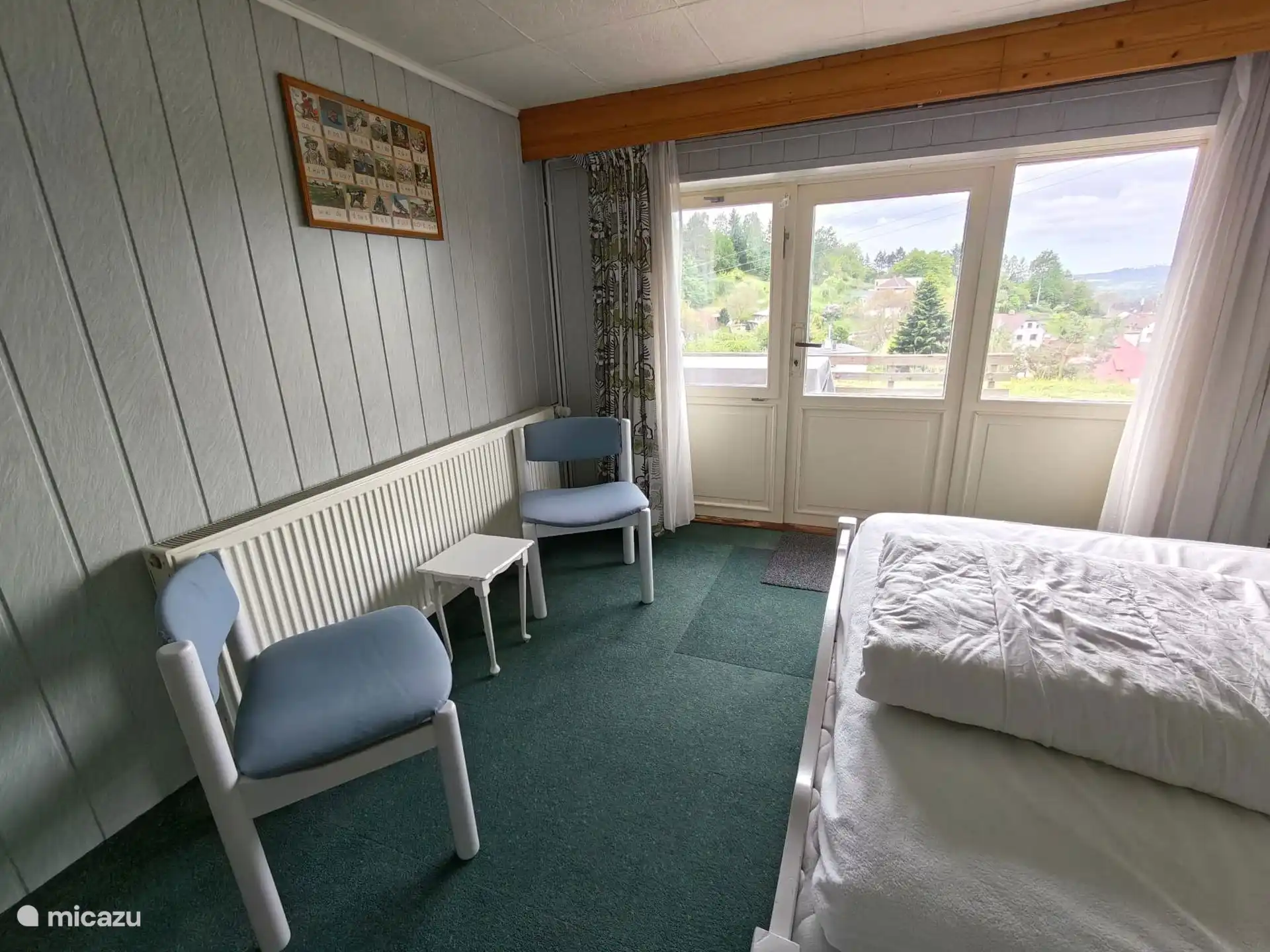 2 person room with seating and patio doors