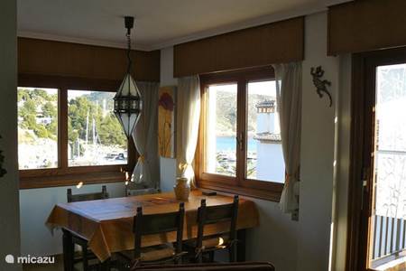 Living-dining room with harbor and sea