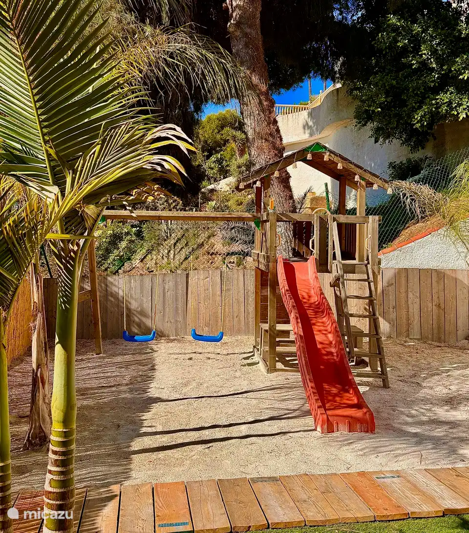 own small private beach with playground equipment for children 