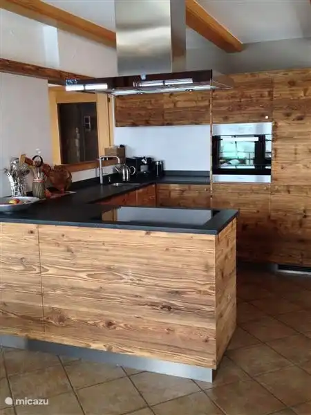 Atmospheric wooden kitchen with all modern appliances