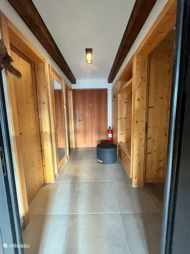 Entrance with wardrobe and cupboard with ski boot warmer.
