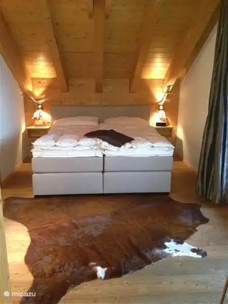 The master bedroom with two single beds and an adjoining large bathroom with bath,
shower, toilet and double sink