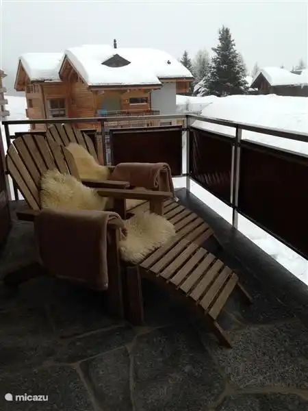 The balcony on the ground floor, with two comfortable loungers