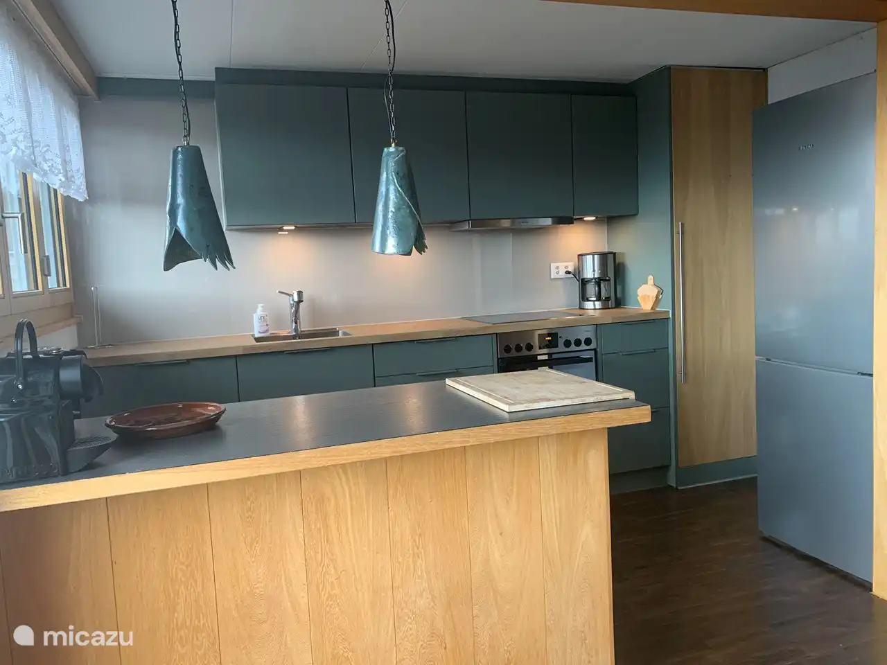 The open kitchen is equipped with all kinds of conveniences.