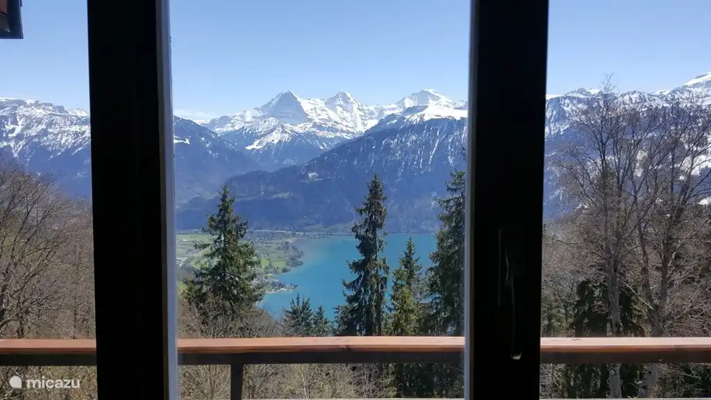 The view over the Lake Thun and the mountains from the living room.