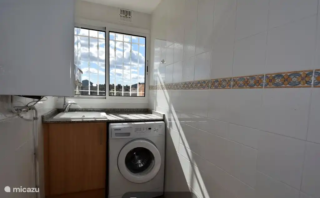 utility room with washing machine and dryer