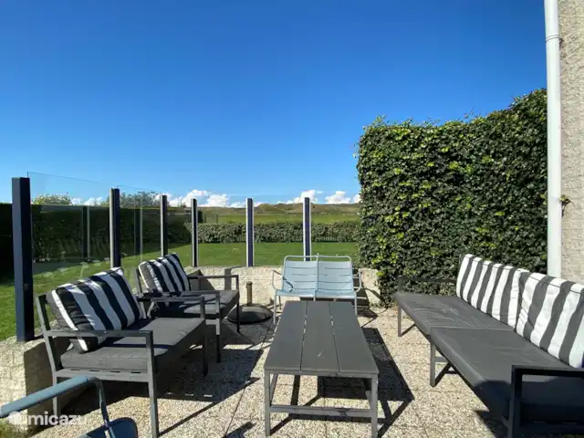 Location de Vacances Pays-Bas, Hollande du Nord, Julianadorp aan Zee, villa - Villa Ooghduyne Jardin avec vue sur les dunes, terrain de jeux, spa extérieur avec hydromassage, ensemble lounge, abri vent, transats, table à manger, BBQ, etc.