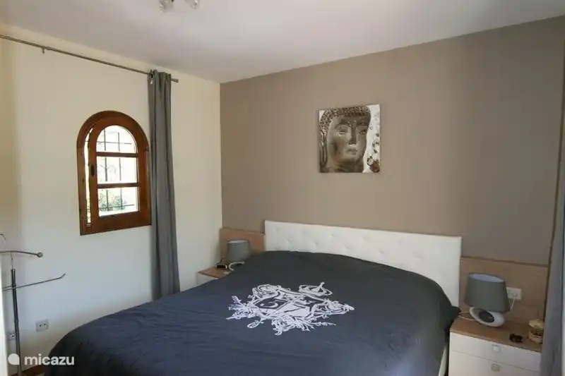 The master bedroom, spacious, air-conditioned and comfortably furnished.