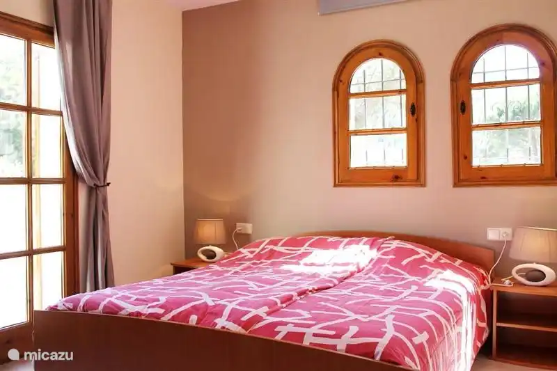 Third bedroom, including air conditioning and large balcony.