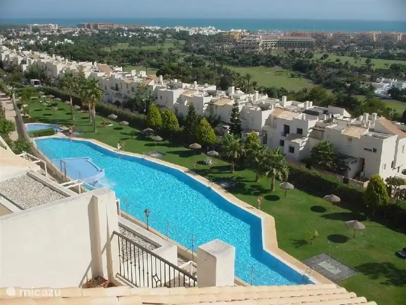 The large pool of residential La Ladera del Golf and the beautiful views from this residential area.