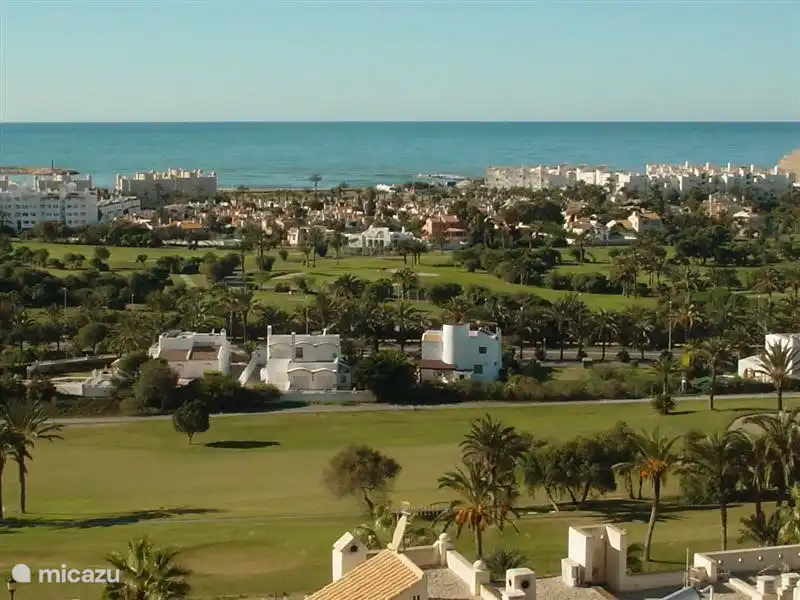 Overlooking the village green Almerimar golf and the sea.