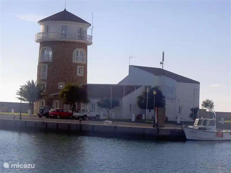 The typical tower at the entrance to the marina of Almerimar.
