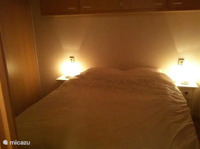 cozy bedroom with large closet and sliding door cupboards