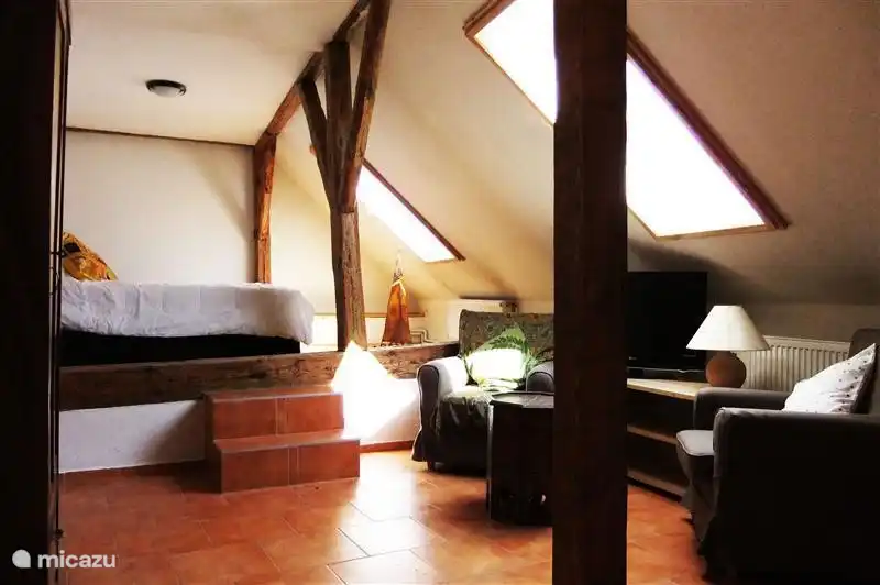 2 bedroom, with satellite TV, double box spring bed and sitting area.