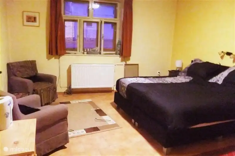 1 bedroom, with satellite TV, seating and wood stove.