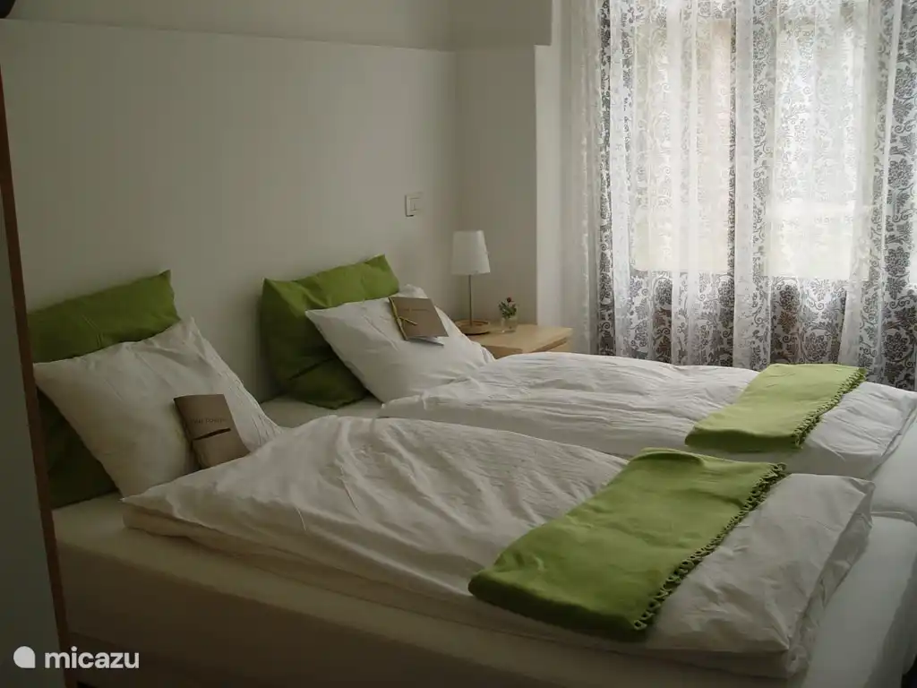 Bedroom with patio doors to the garden.