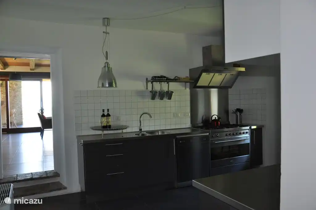 The kitchen on the first floor is spacious and fully equipped. Here you can prepare delicious meals together.