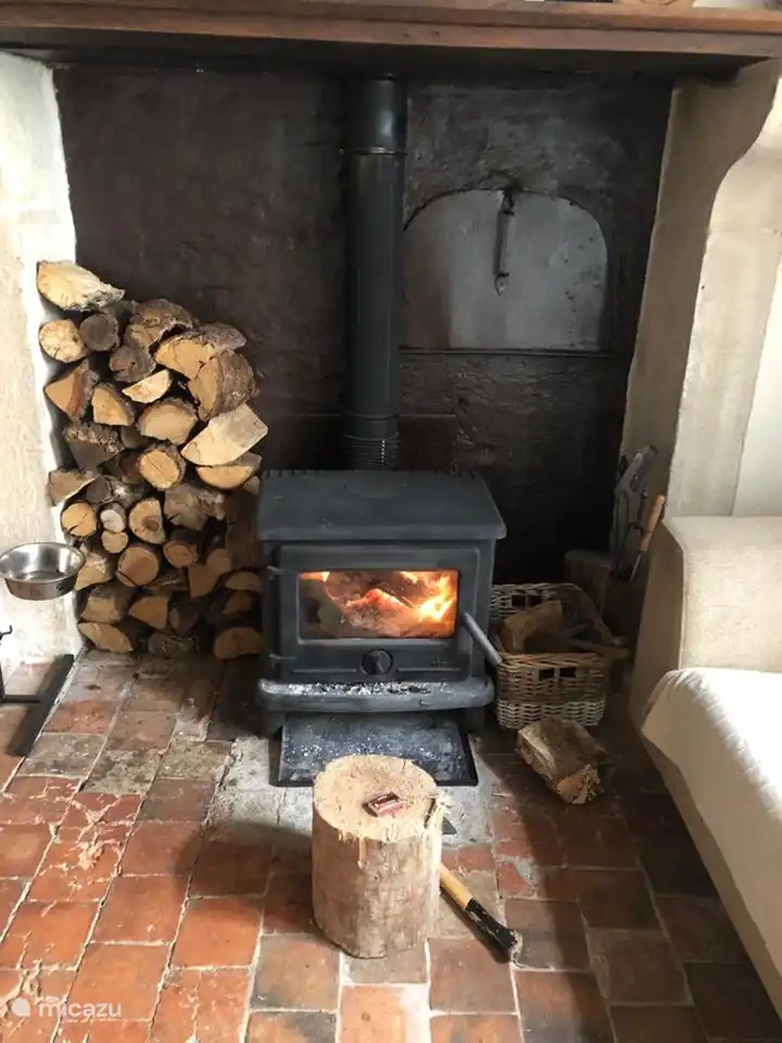 One of the two wood fireplaces that heat the house in the winter.