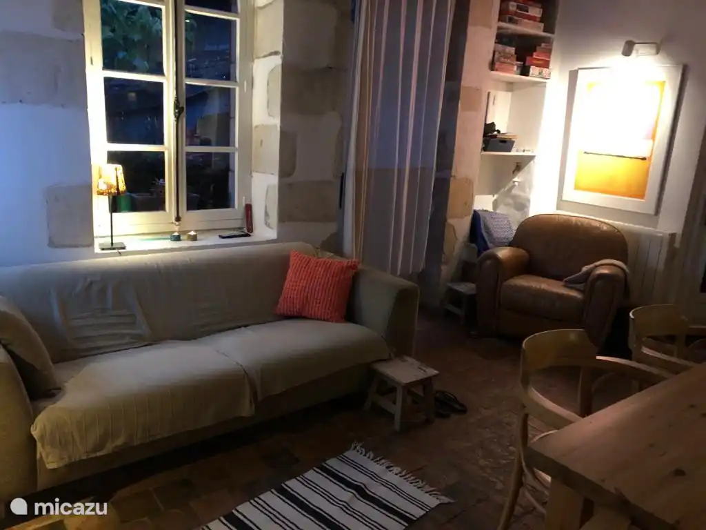 The kitchen-diner has a lovely chair and a three-seater sofa.